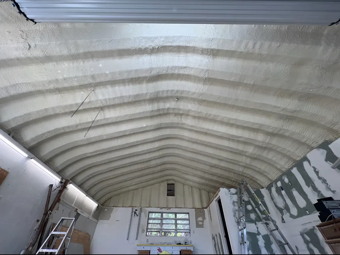 Spray polyurethane foam applied to the underside of a metal roof deck in Broadalbin